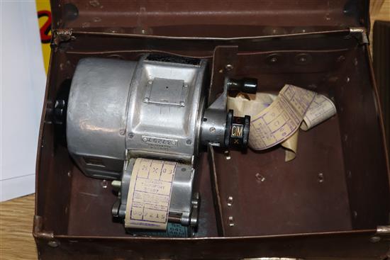 A Gibson A14 London bus ticket machine and a Swedish AB Almex ticket machine, both in fitted leather cases